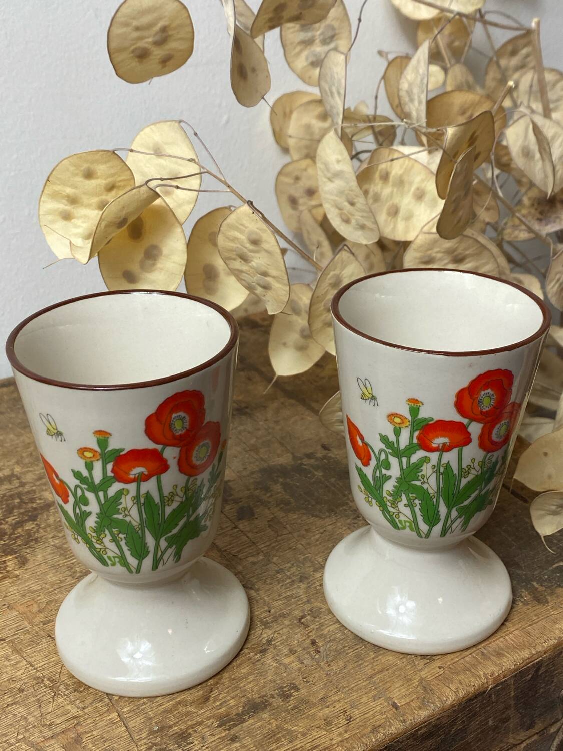 Pair of stoneware mazagrans, poppy decoration