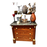 Empire chest of drawers with half columns in mahogany and gilded bronze