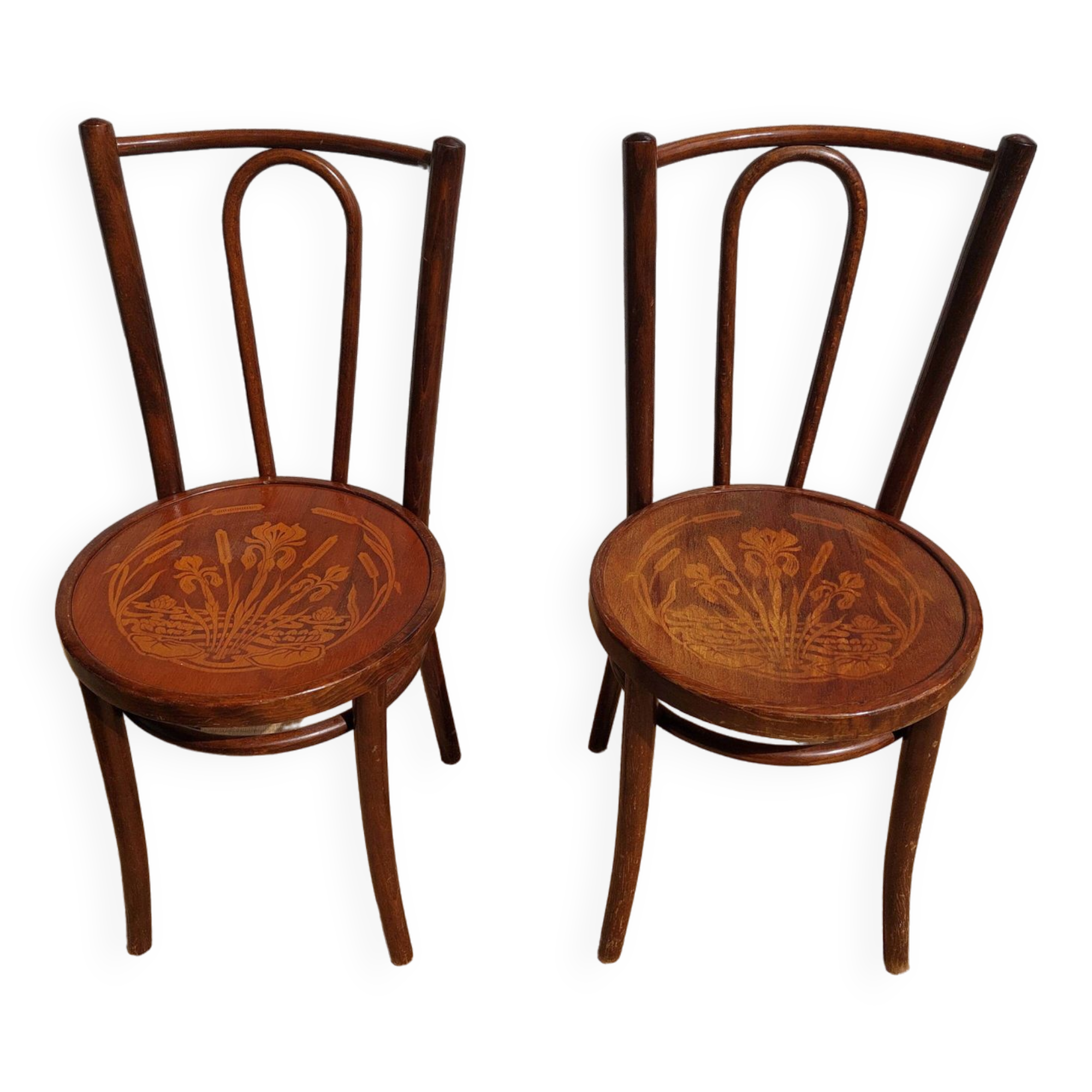 pair of bistro chairs, curved wood and pattern on the seat
