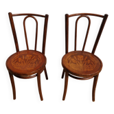 pair of bistro chairs, curved wood and pattern on the seat