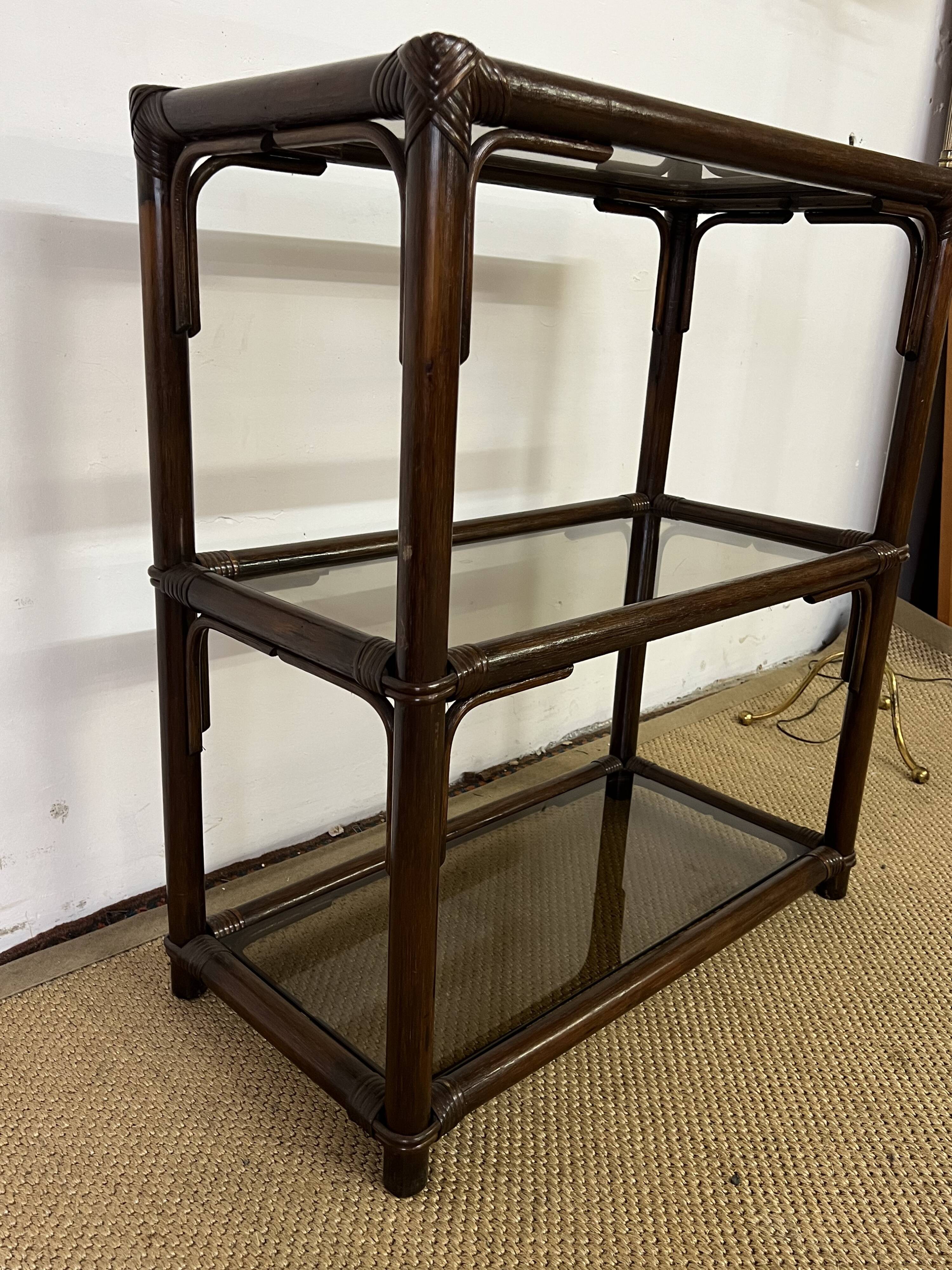 Rattan and smoked glass bookcase shelf