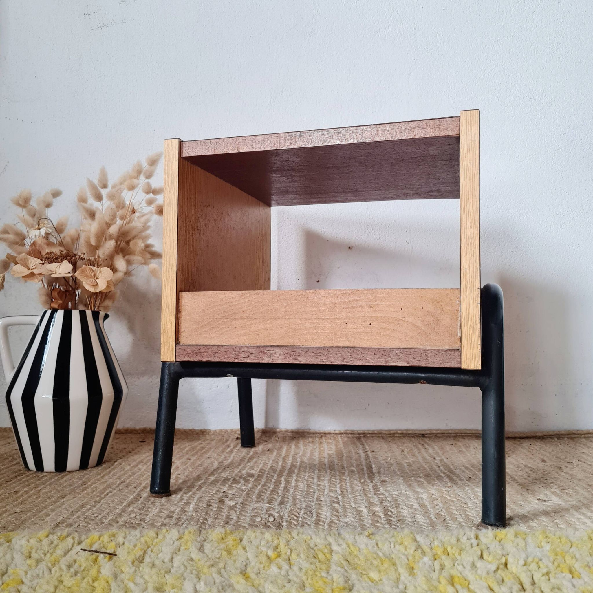Bedside table - small wooden piece of furniture with a tubular metal base.