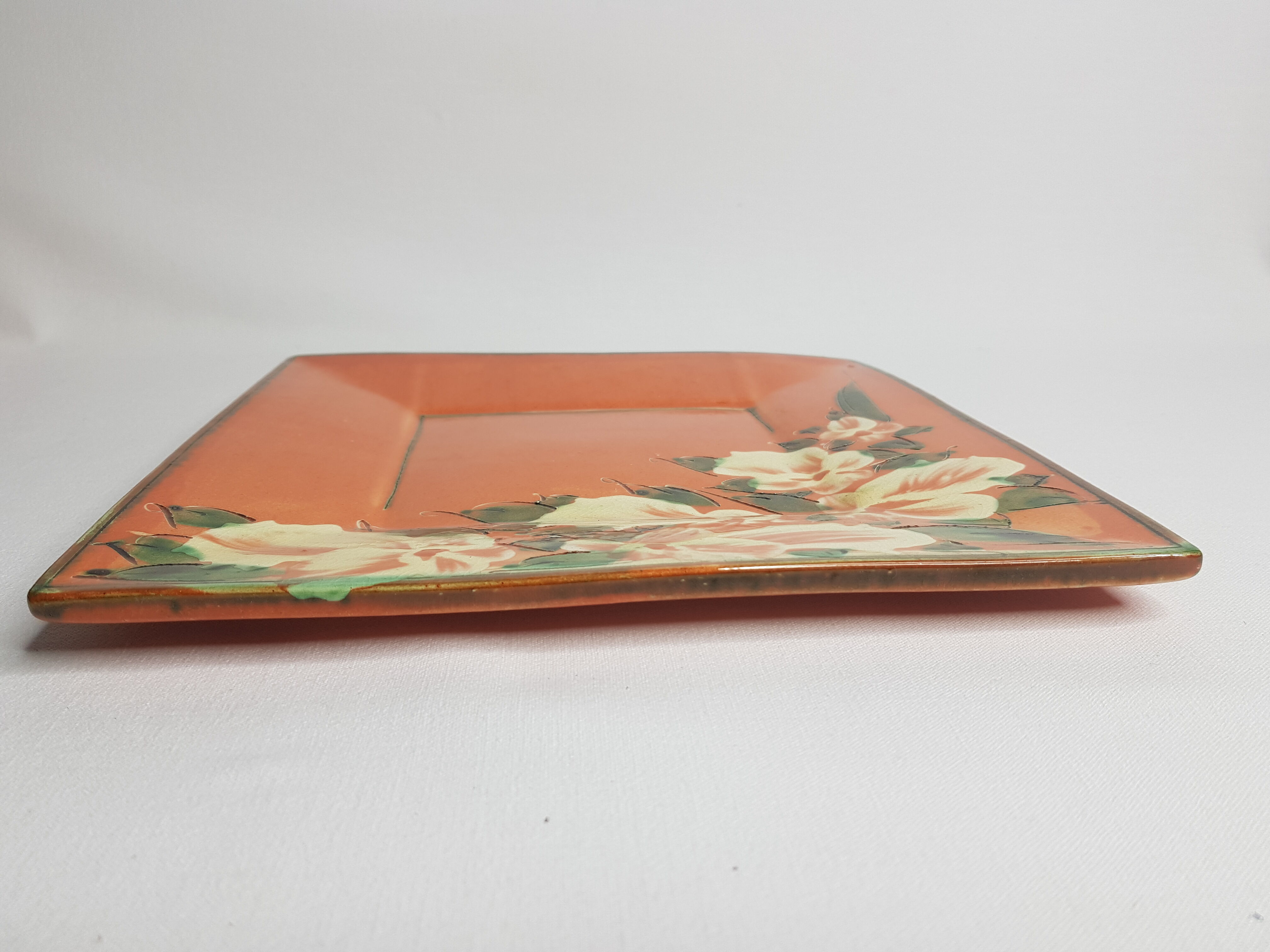 Dish or plate Pottery Galtié enamelled terracotta decorated with flowers, 24.5 cm