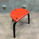 Red tripod stool in industrial style