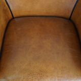 Fauteuil en cuir de mouton à l'aspect luxueux