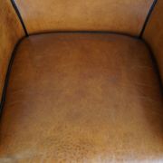 Fauteuil en cuir de mouton à l'aspect luxueux