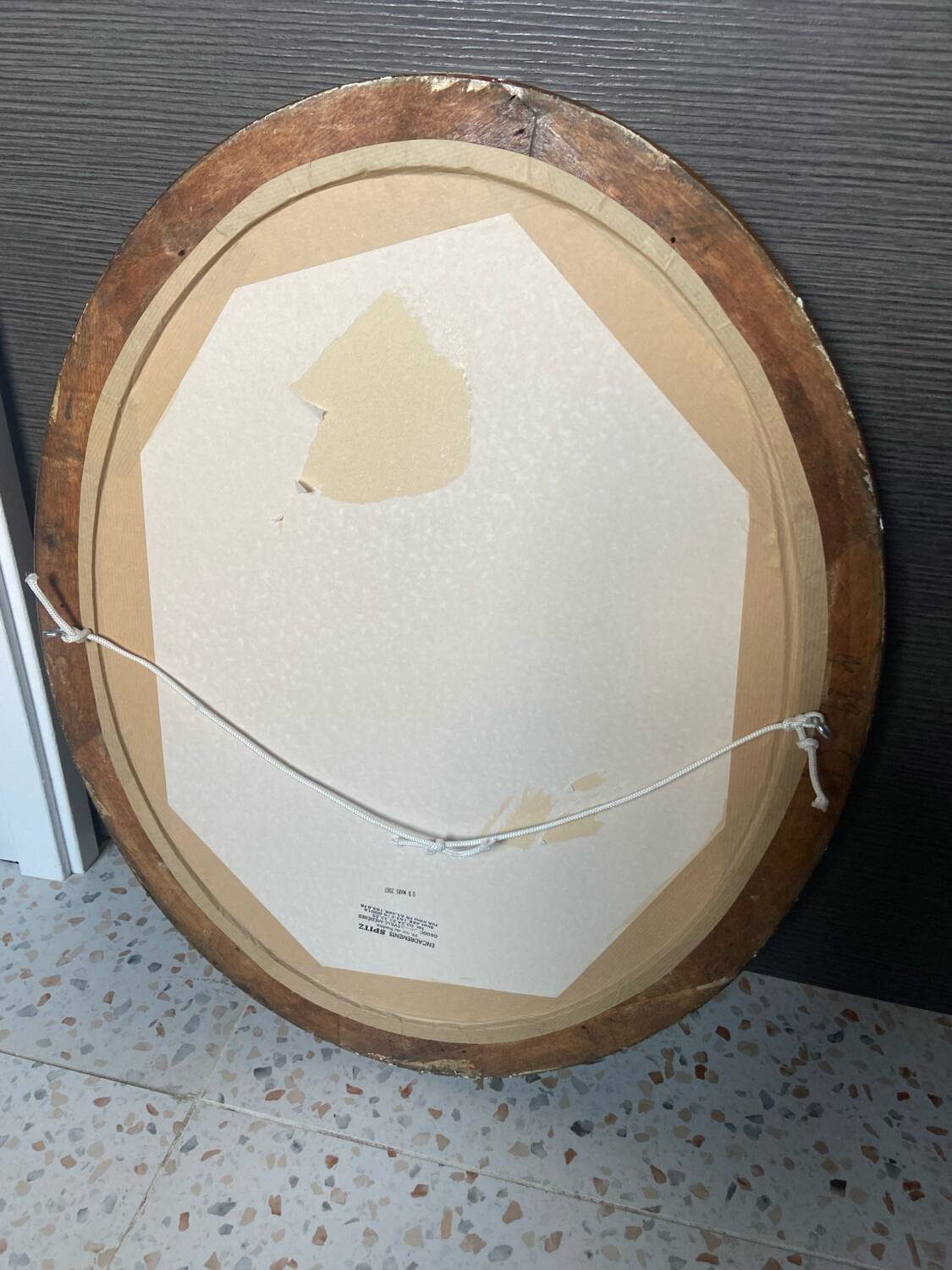 Antique oval frame with an oil painting of green collars