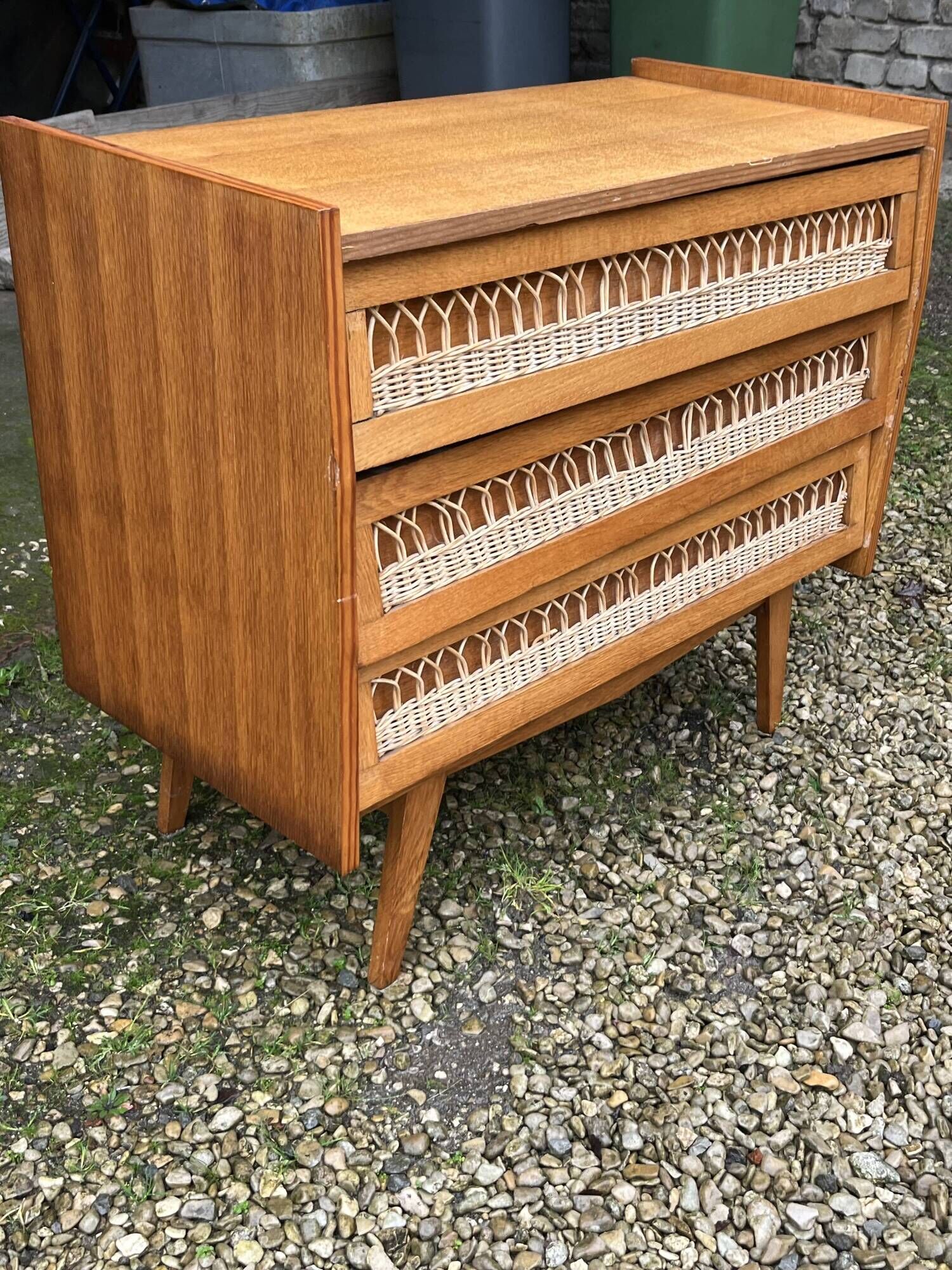 Rattan chest of drawers with tapered legs