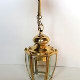 Golden hanging lamp with bevelled glasses
