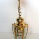 Golden hanging lamp with bevelled glasses