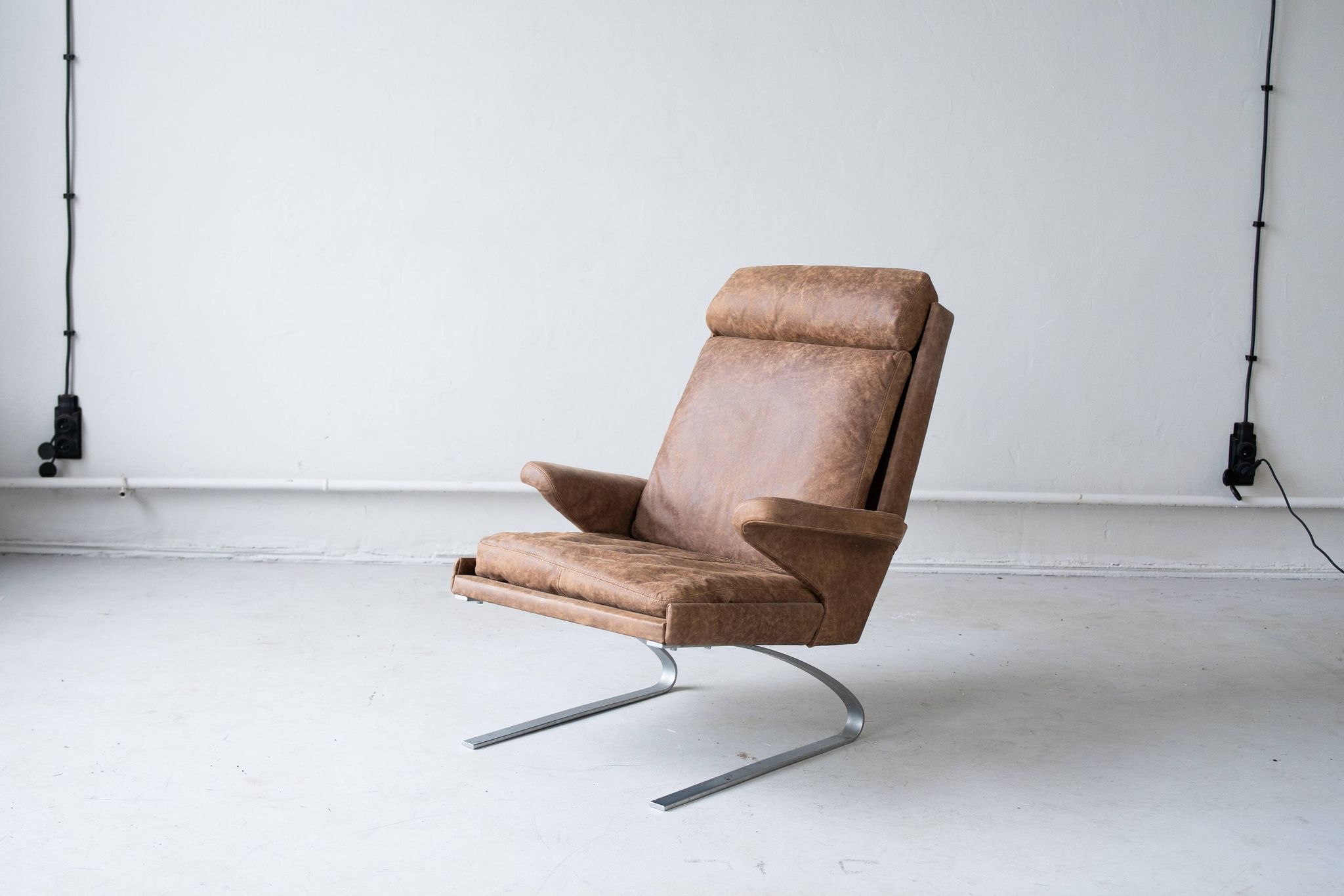 Vintage swing armchair and stool in leather by reinhold adolf for cor, 1970s, set of 2