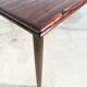 Rosewood dining table with integrated extensions — Denmark, 1960s