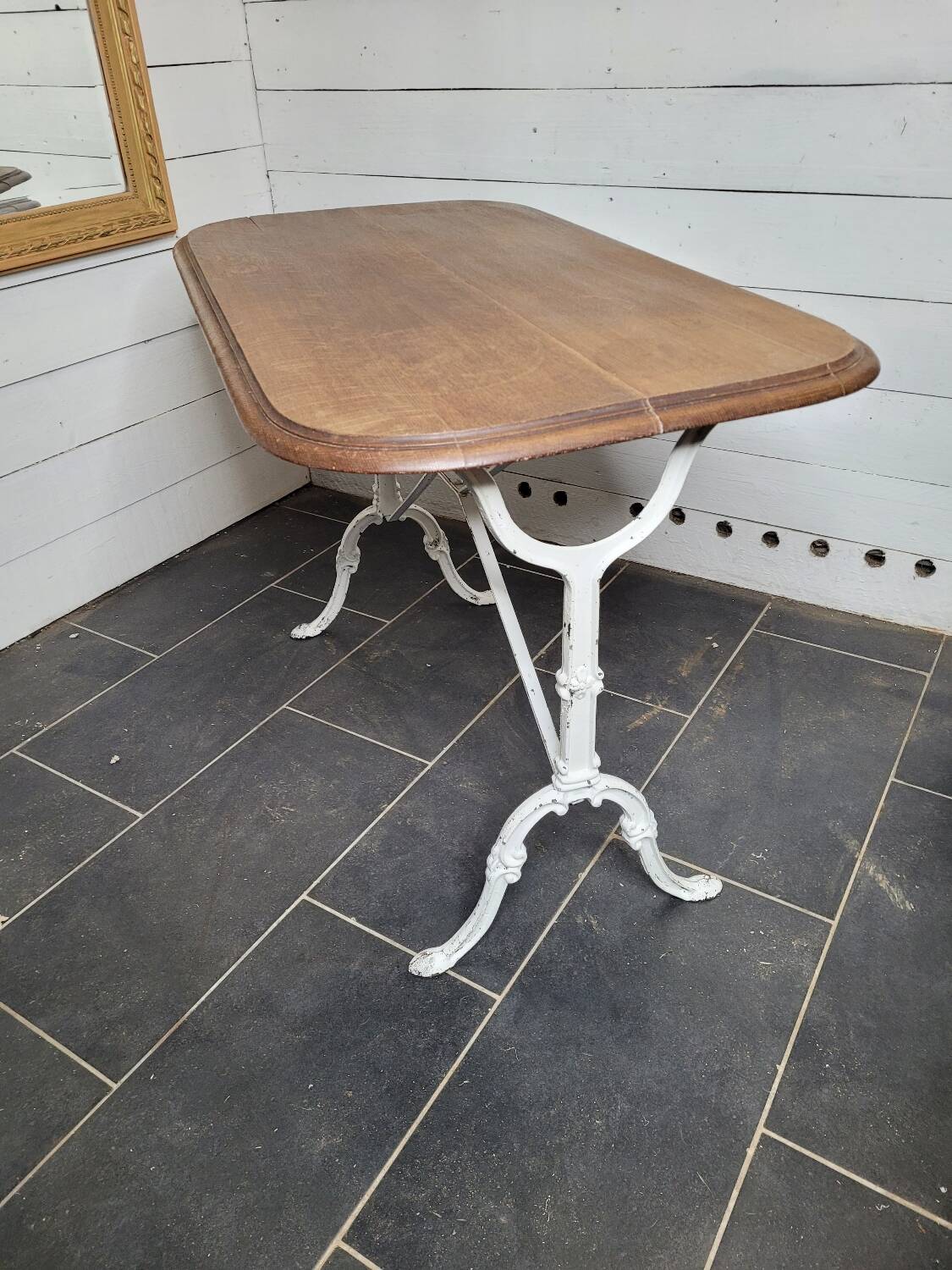 Bistro table with cast iron base and oak top