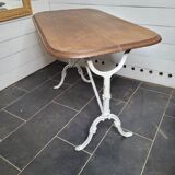 Bistro table with cast iron base and oak top
