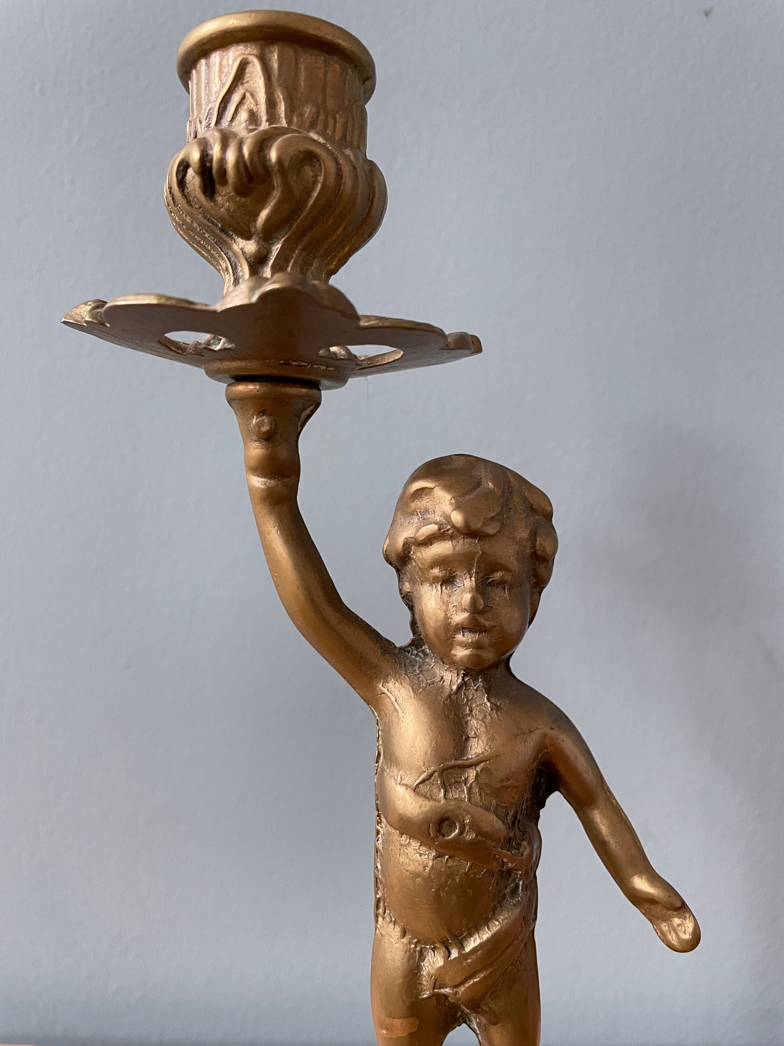 Old candlestick candlestick cherub in bronze