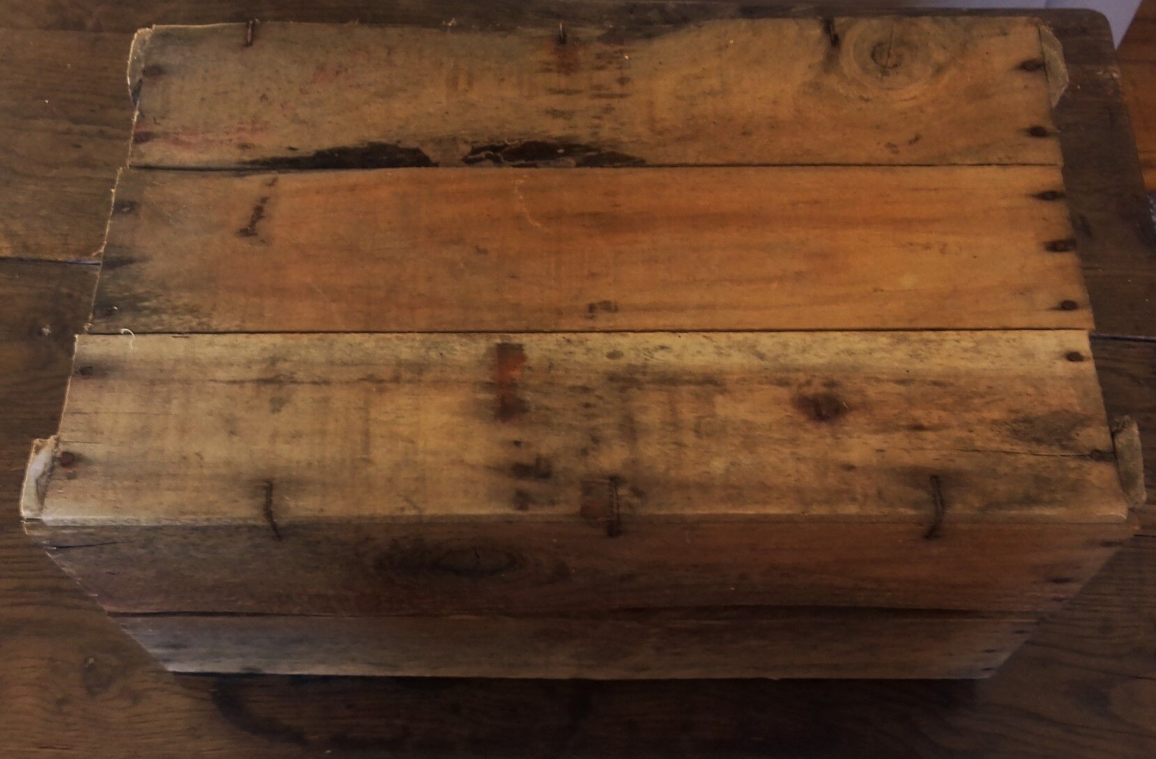 Wooden case with letters in black inck