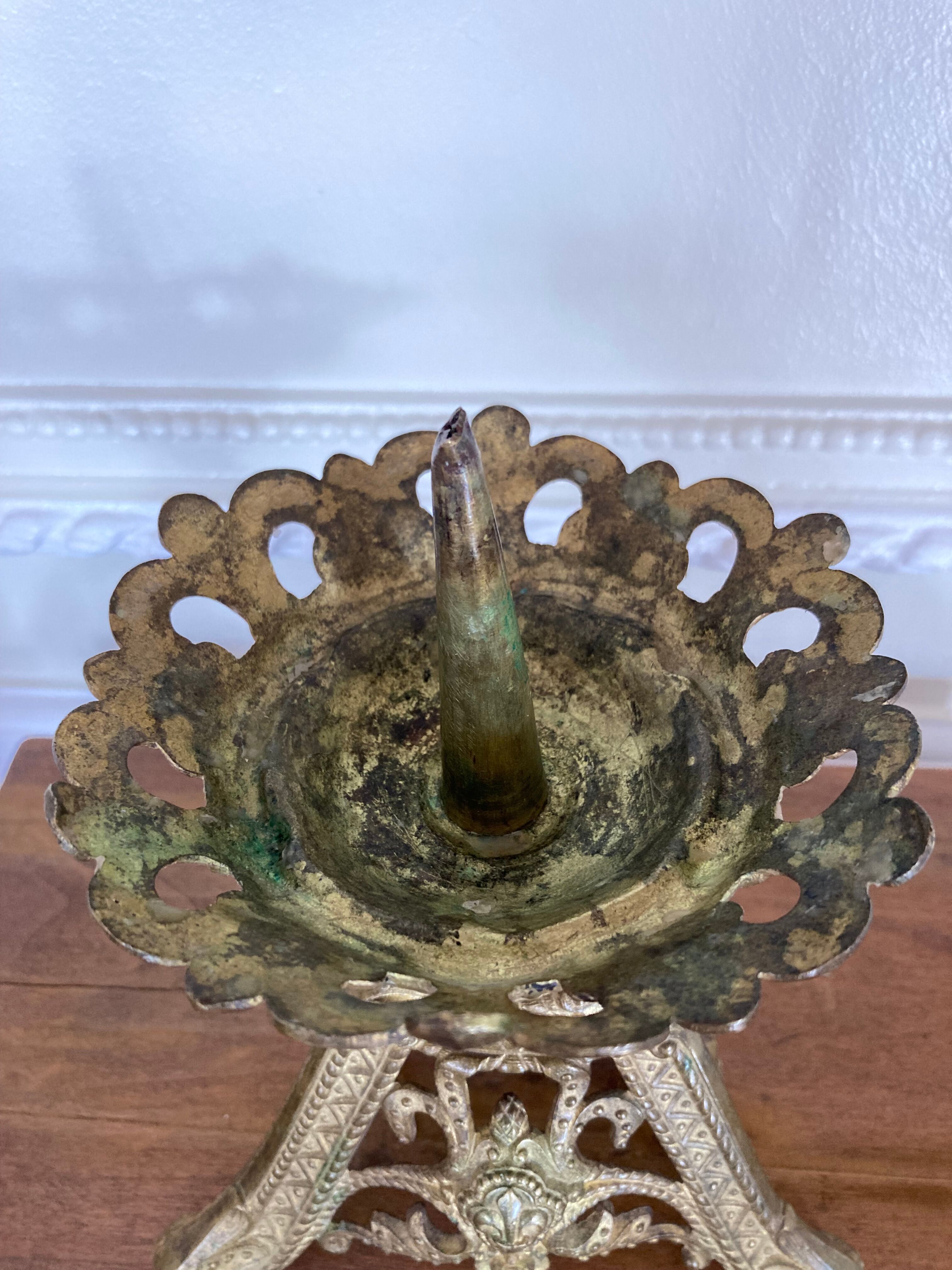 Candle holder church in gilded metal