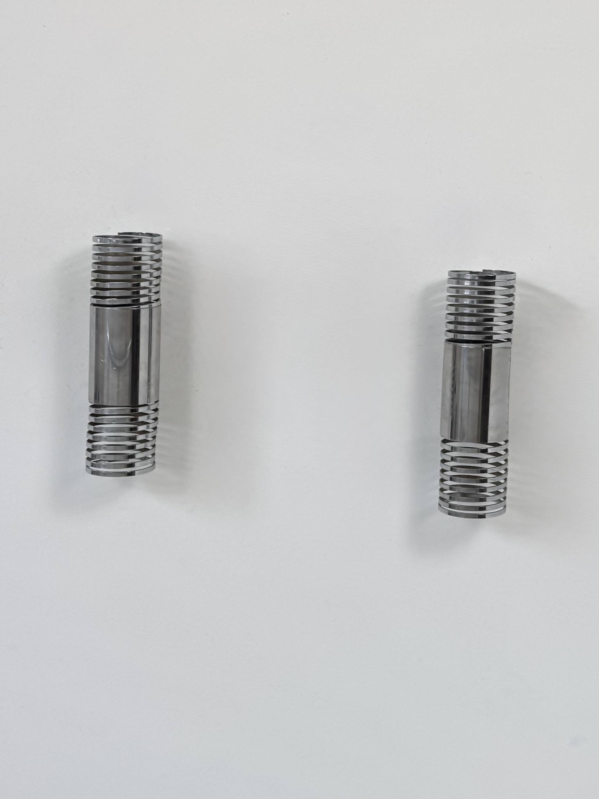 Pair of vintage chrome metal wall lights, France, 1970.
