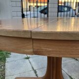 Extendable round dining table and 4 Baumann chairs.