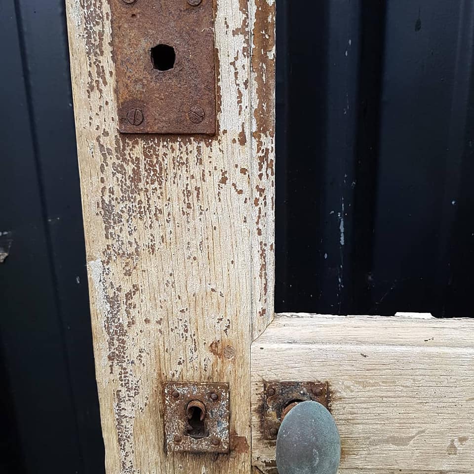 Ancient paneled solid oak door with 3 windows