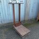Old scale at pharmacy wood house rongier weighs person