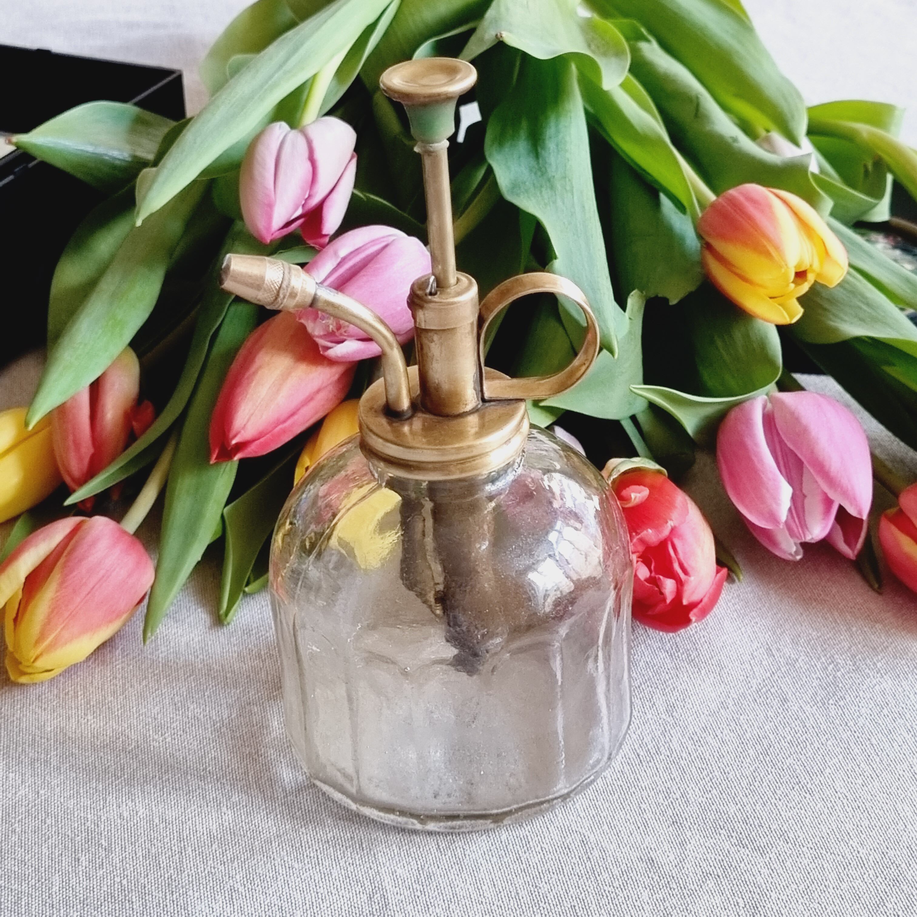 Brass and transparent glass sprayer