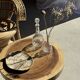 Coffee table in solid suar with central leg and spheres H56.5 D55.5