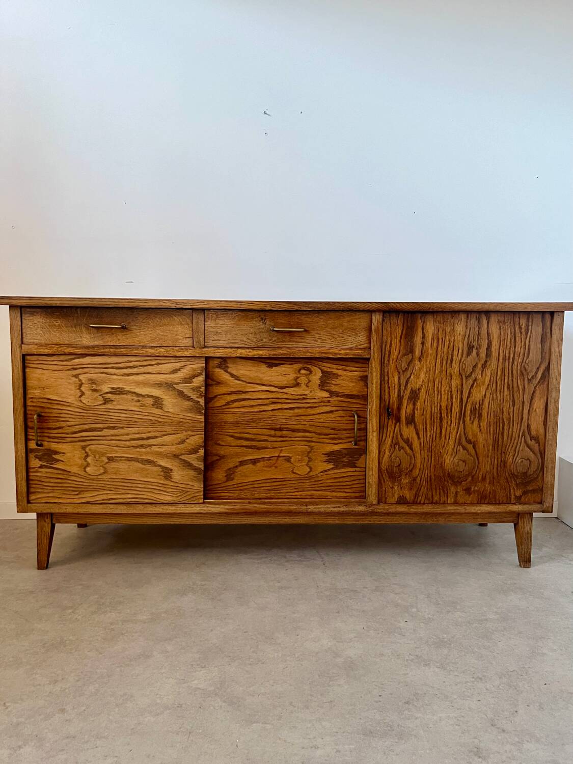 Old oak sideboard from the 1950s, vintage reconstruction period