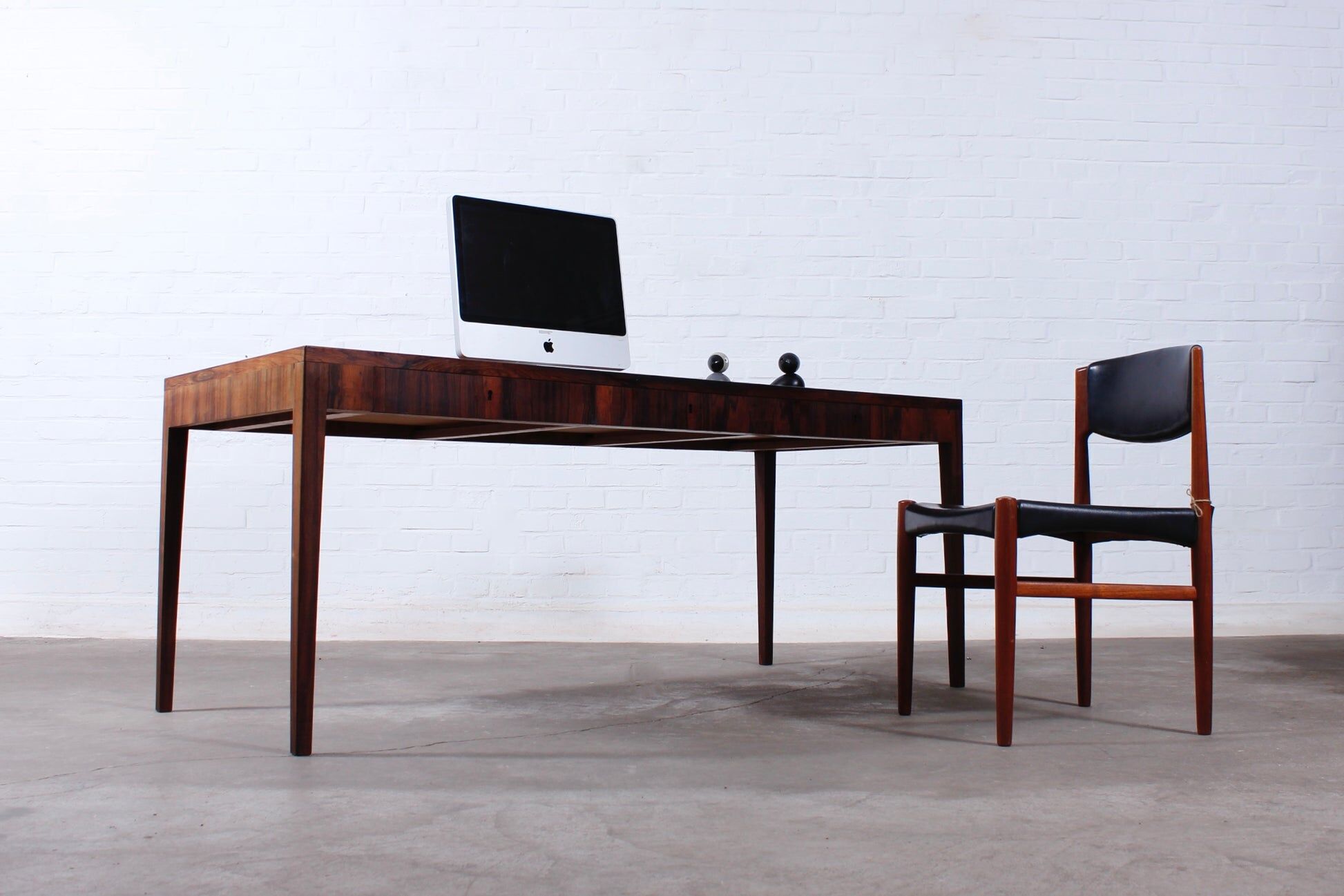 Minimalist rosewood desk by Riis Andersen