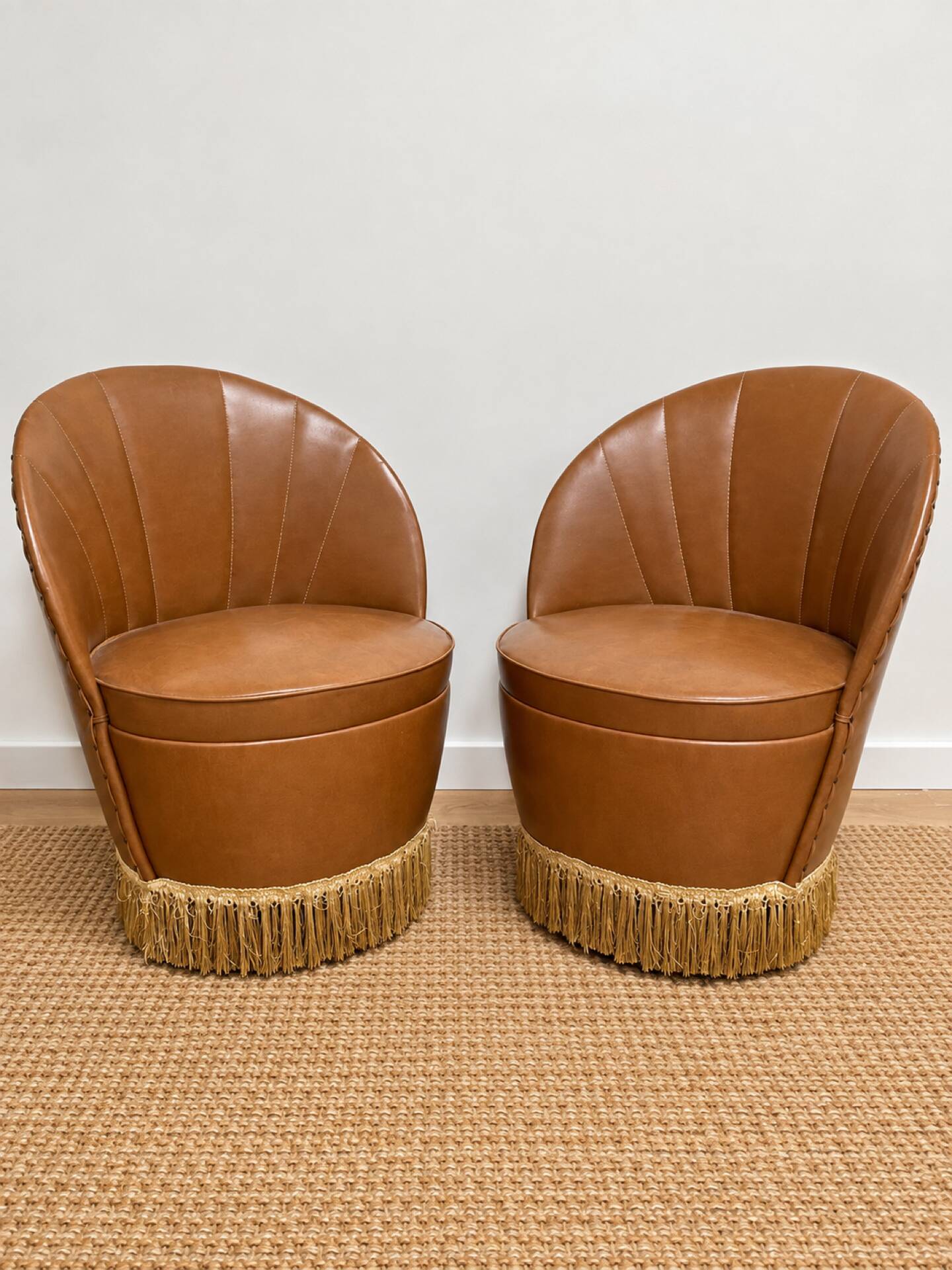 Vintage cognac fringe tub chairs