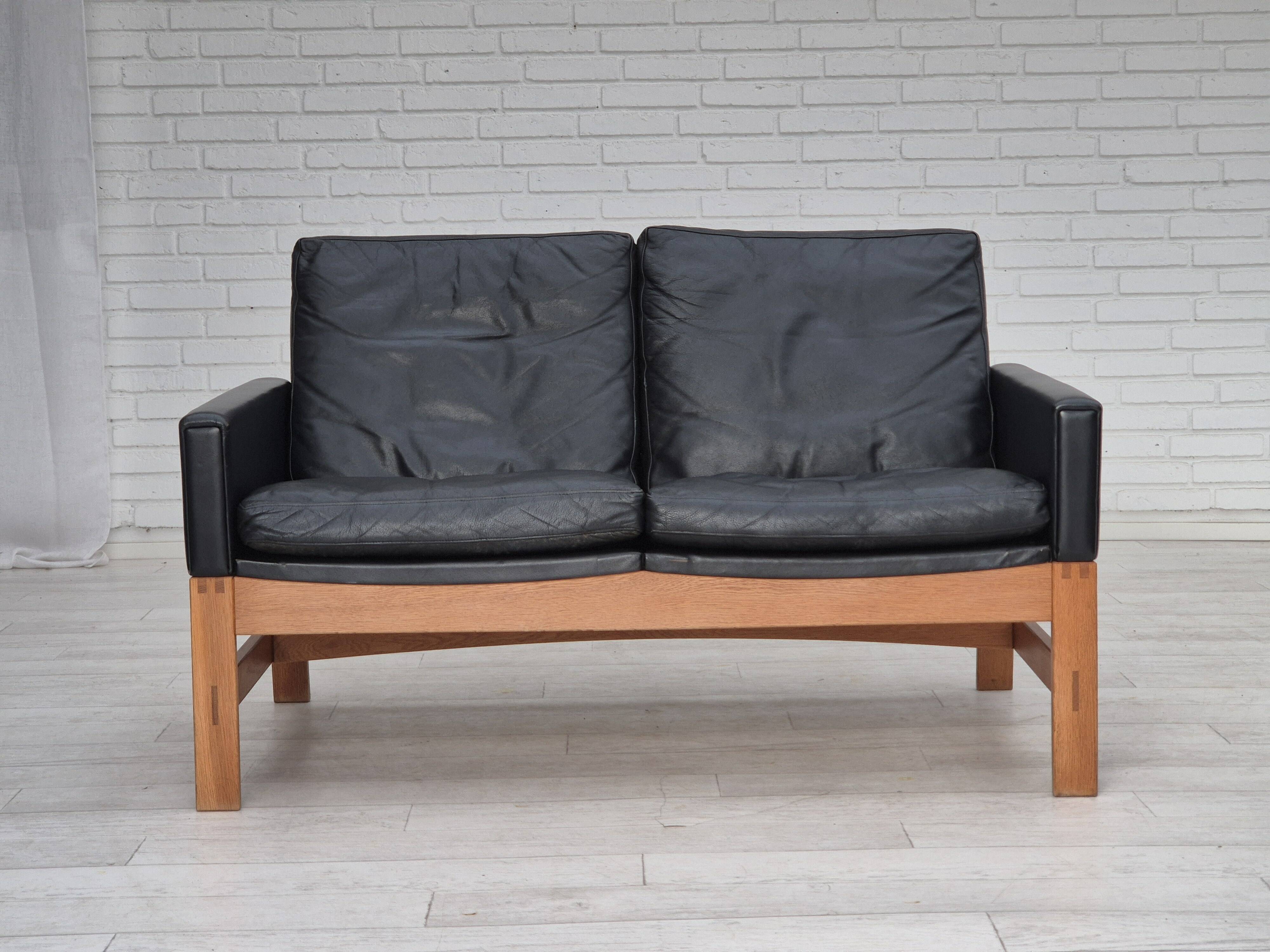 1960s, Danish 2-seater sofa in original condition, furniture leather, solid oak wood.