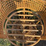 Vintage peacock chair in sculptural blonde rattan, fan back from the 1970s.