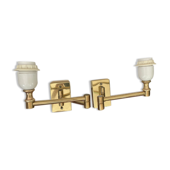 Pairs of brass articulated wall lamps