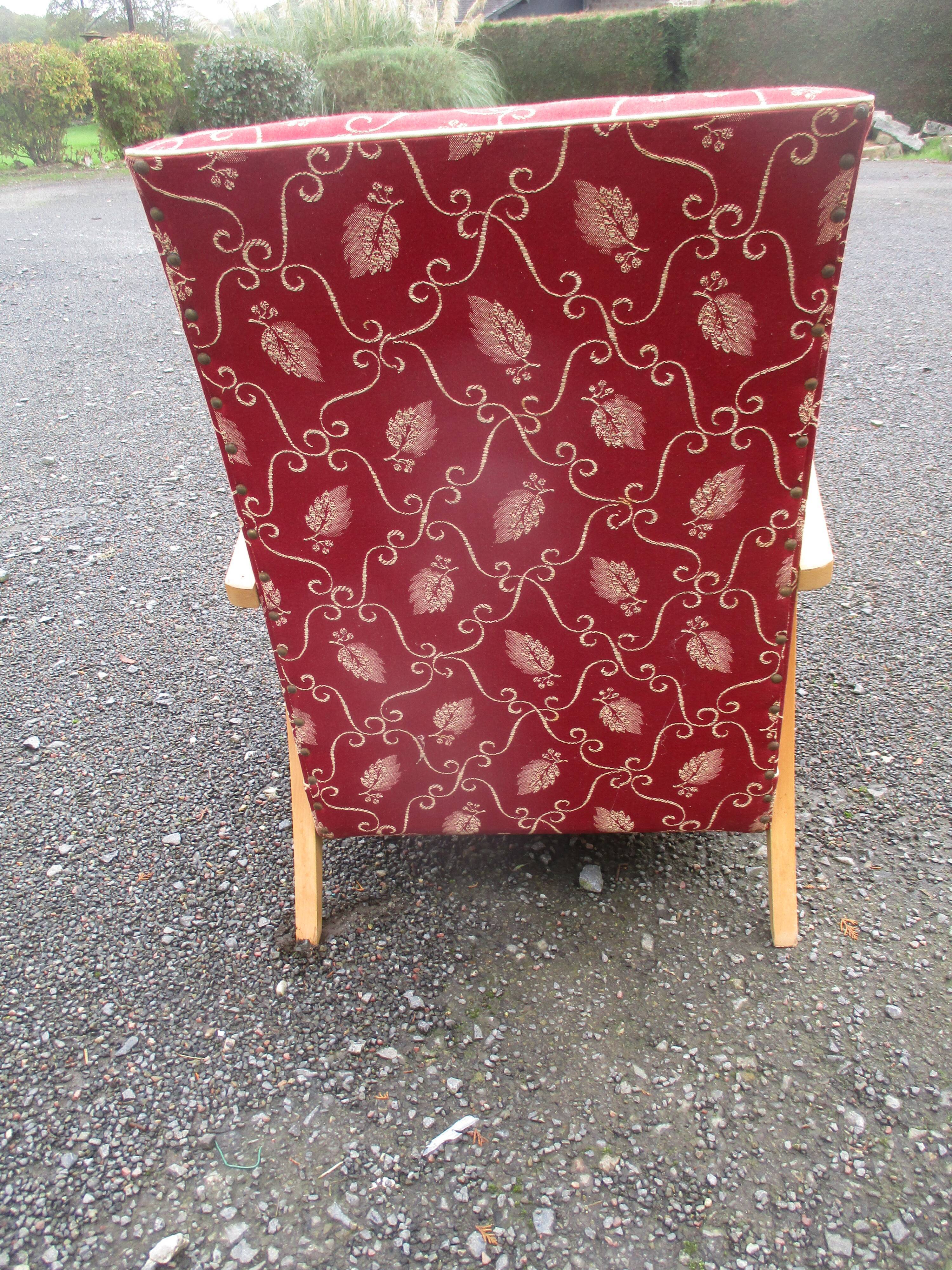 Scandinavian armchair in wood and red fabric