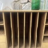 On a piece of furniture with sorting lockers and drawers