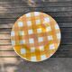 Set of nine flat ceramic plates yellow Scottish decoration in yellow/orange gridded ceramic