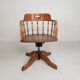 Oak office chair with a spring system and height adjustable, 1930s.