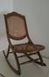 Fauteuil à bascule en cannage vintage
