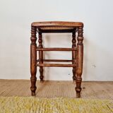 Wooden stool with cane seat