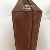 Suitcase of leather with labels of palaces