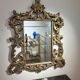 Gold wooden wall mirror with floral decoration
