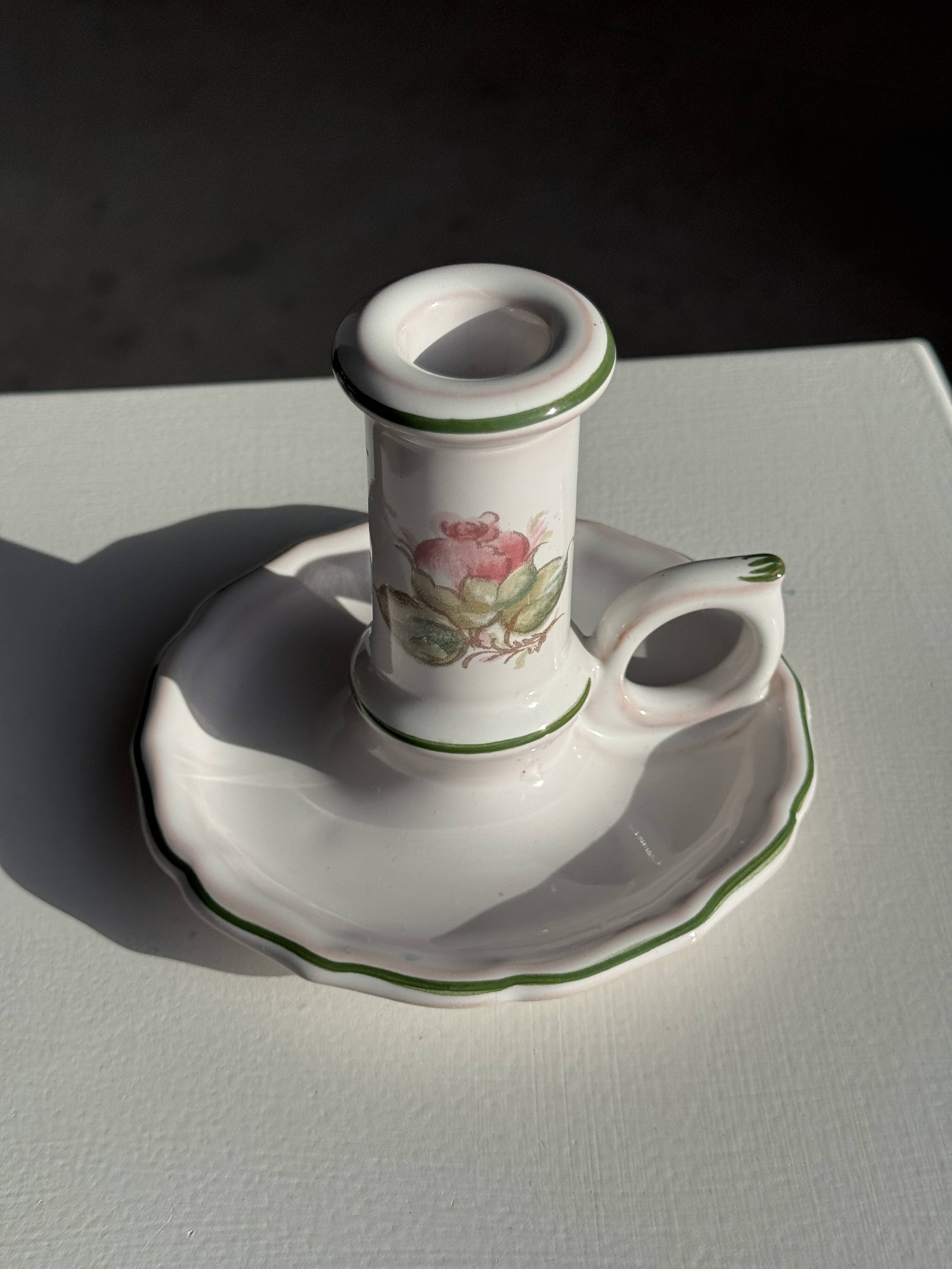 Small vintage hand-held candlestick in earthenware with green trim and floral decoration H10.5