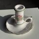 Small vintage hand-held candlestick in earthenware with green trim and floral decoration H10.5