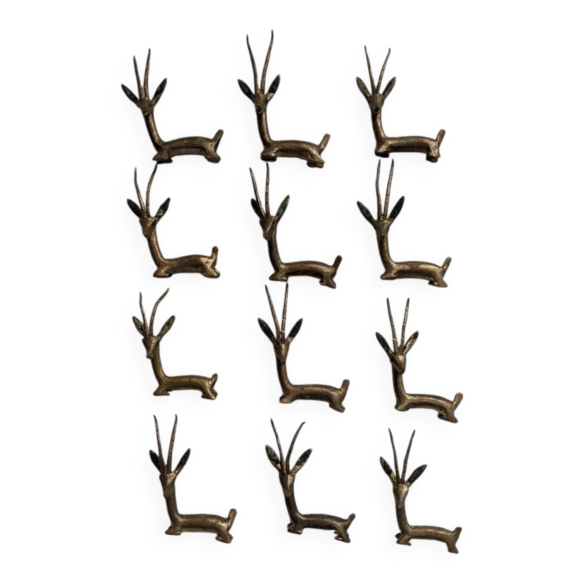 12 bronze and brass knife rests, African art, gazelles