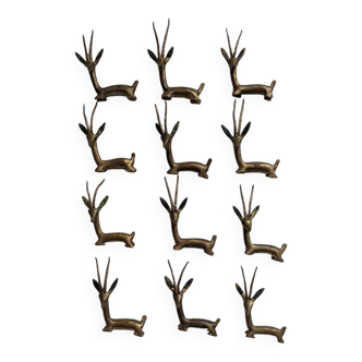 12 bronze and brass knife rests, African art, gazelles
