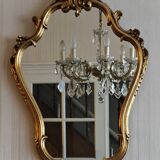 Miroir de rocaille sous cadre doré