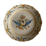 Plate of Nevers in earthenware late eighteenth century decoration of crest to flower