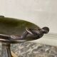 Bronze cup on a yellow Siena marble base, early 19th century.