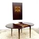 Danish round dining table in rosewood – 1950s design with butterfly extension.