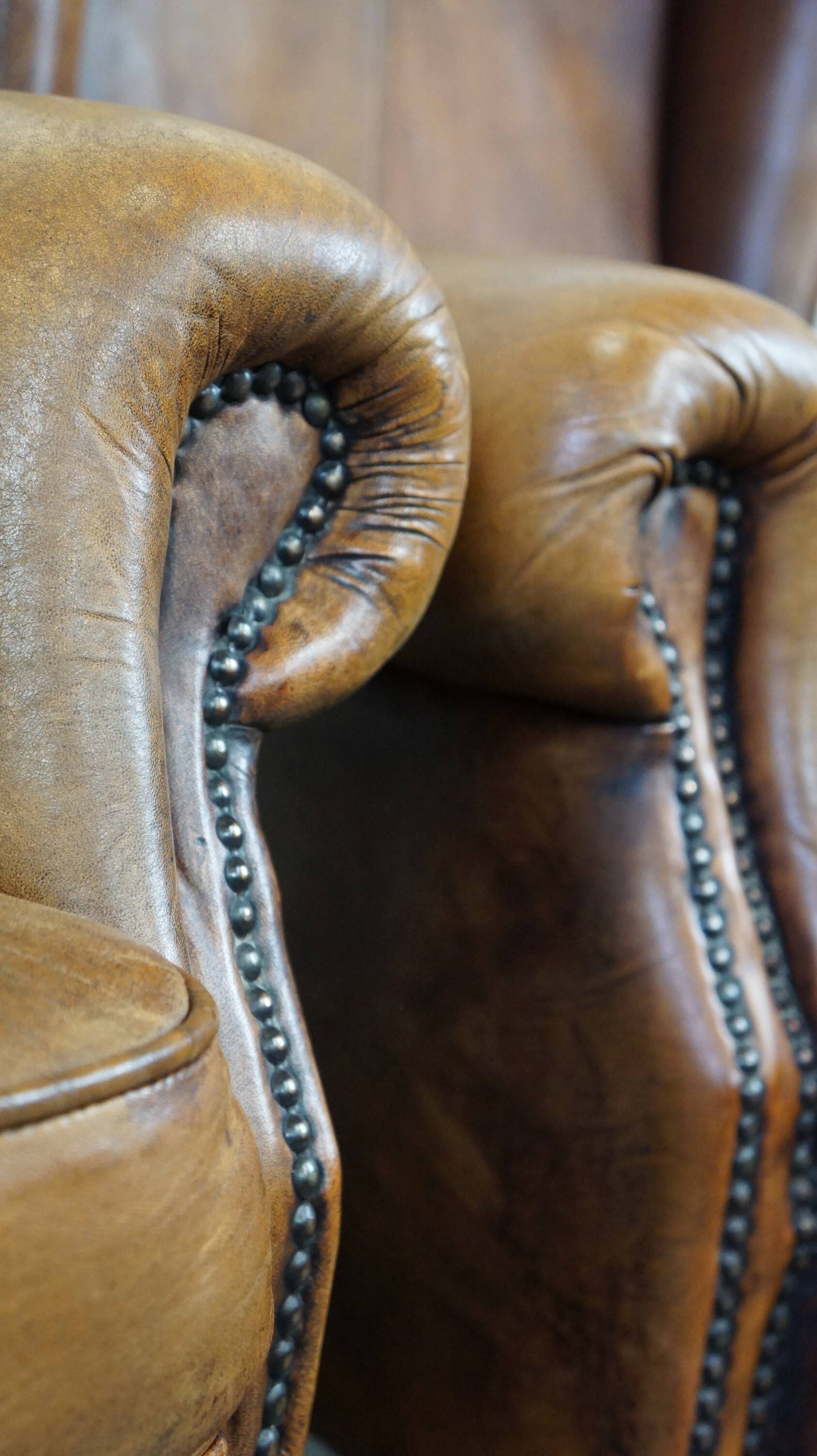 Set of 2 beautiful and correct sheep leather wingback armchairs with fixed seat cushions